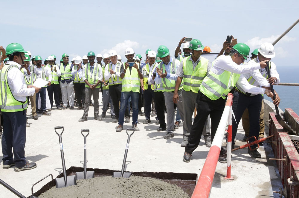 Senior Project Team each laid the final cement to the structure using ceremonial shovel