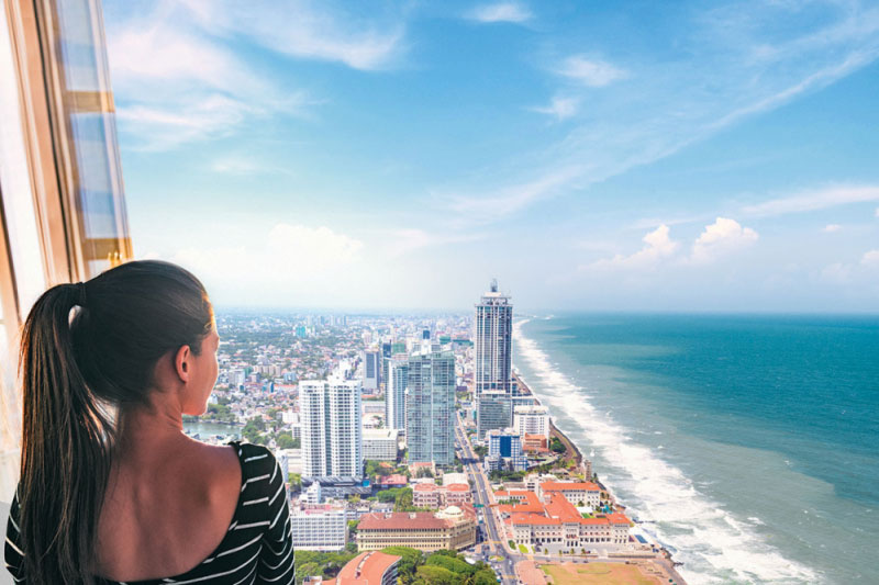 A girl looking out from Sapphire Residence towers